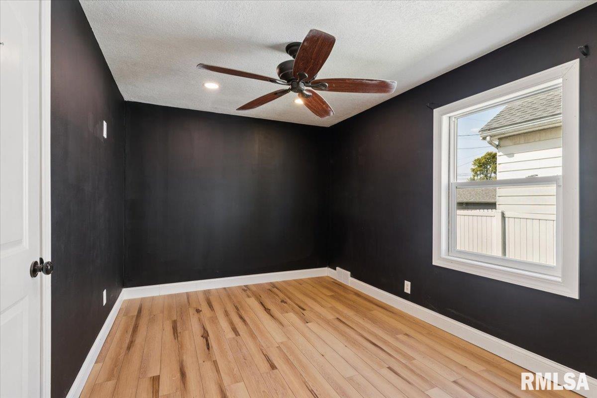 1911 23rd Street, Unit A Moline, IL 61265 - Photo 15 of 28 a view of empty room with wooden floor