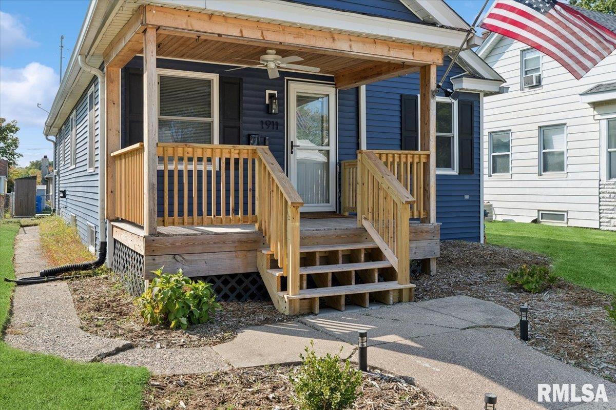 1911 23rd Street, Unit A Moline, IL 61265 - Photo 2 of 28 a front view of a house with a yard