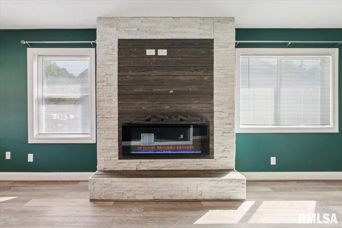 1911 23rd Street, Unit A Moline, IL 61265 - Photo 5 of 28 a view of fireplace and windows