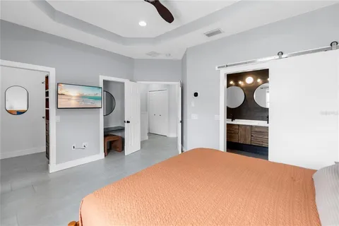 a bedroom with a bed and cabinets