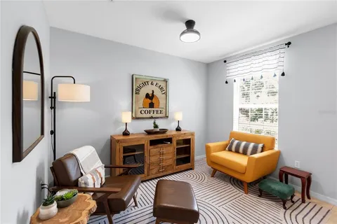 a living room with furniture and a window