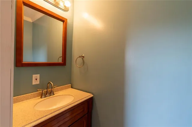a bathroom with a sink and mirror