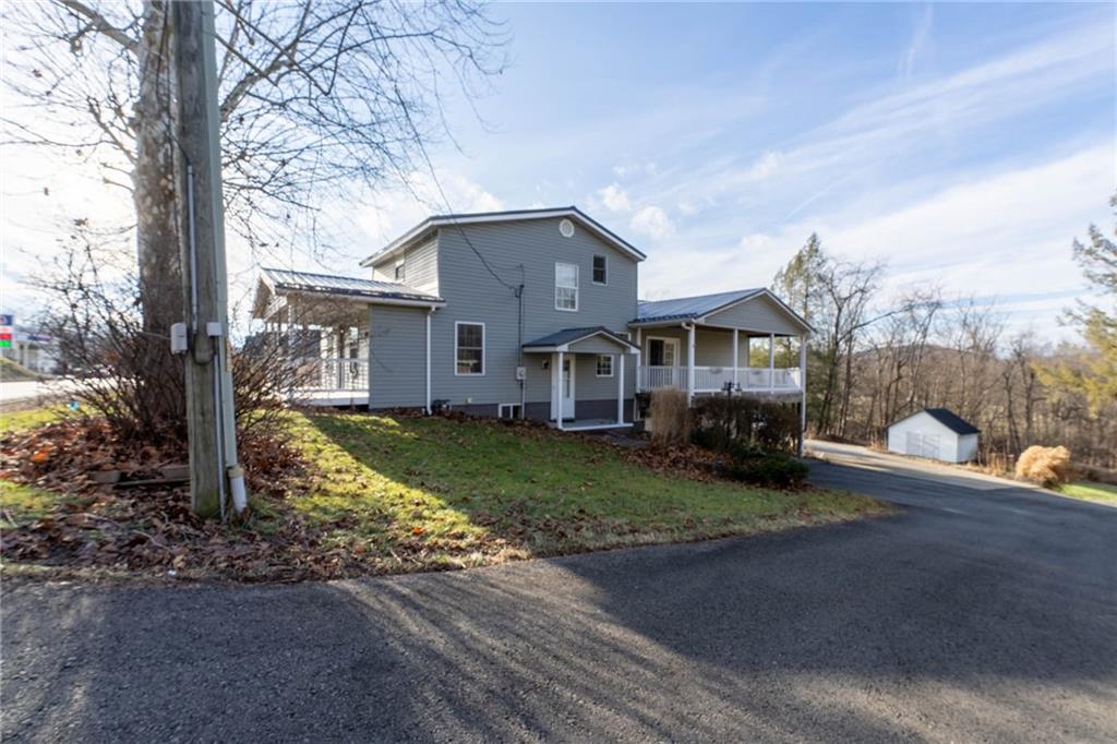 1509 Jefferson Road Jefferson, PA 15344 - Photo 2 of 29 a front view of a house with garden