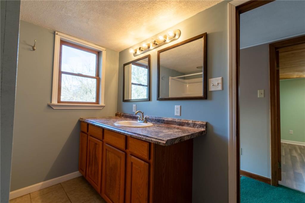 1509 Jefferson Road Jefferson, PA 15344 - Photo 23 of 29 a bathroom with a toilet sink and mirror