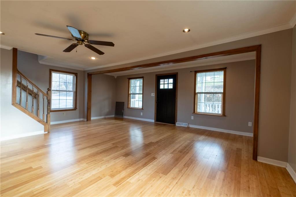 1509 Jefferson Road Jefferson, PA 15344 - Photo 4 of 29 a view of empty room with wooden floor and fan