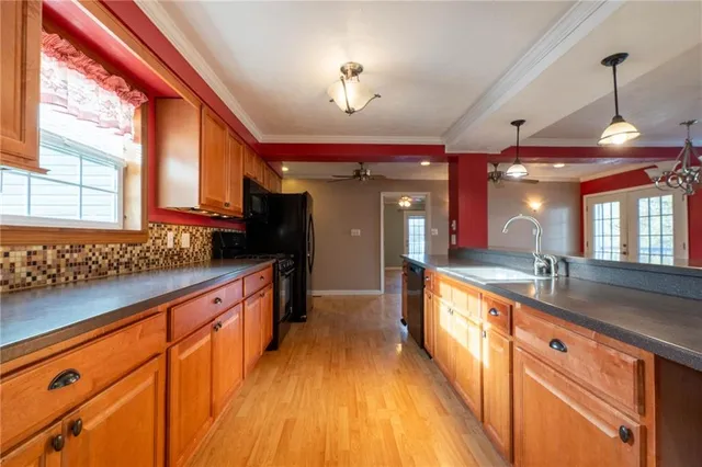 a large kitchen with a large window