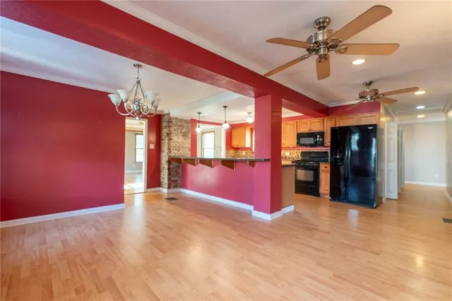 a view of a kitchen with a refrigerator
