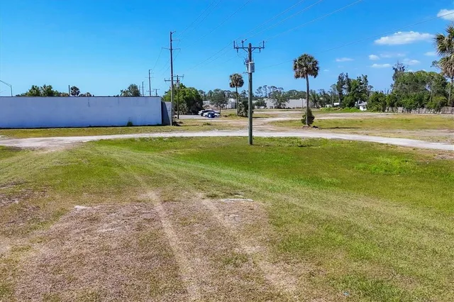 a view of a swimming pool with a yard