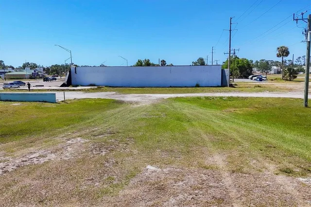 a view of a swimming pool with a yard