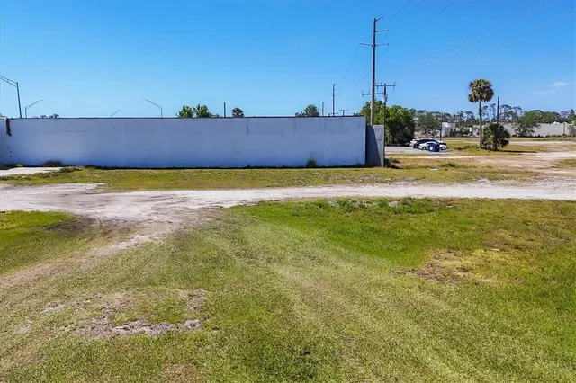 a view of a swimming pool with a yard
