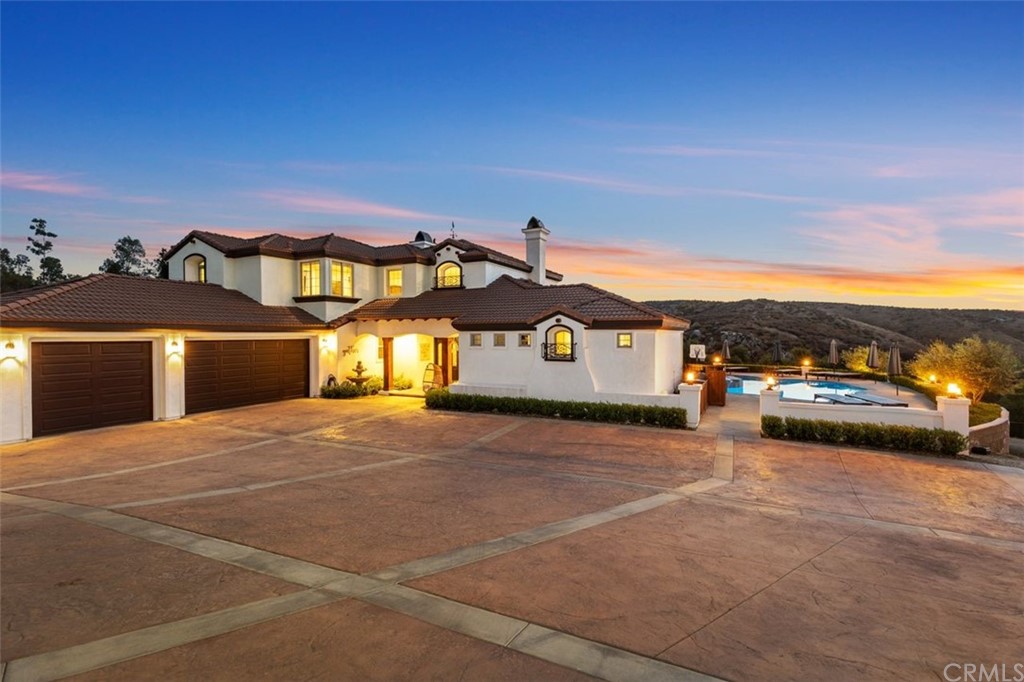 2048 Middle Creek Road Riverside, CA 92506 - Photo 1 of 1 a front view of a house with a yard and garage