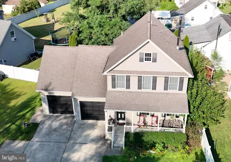 a aerial view of a house with a garden and plants
