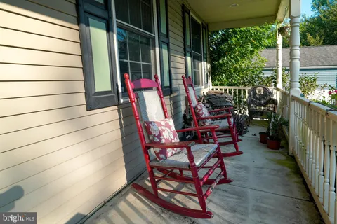 a view of a balcony with chairs