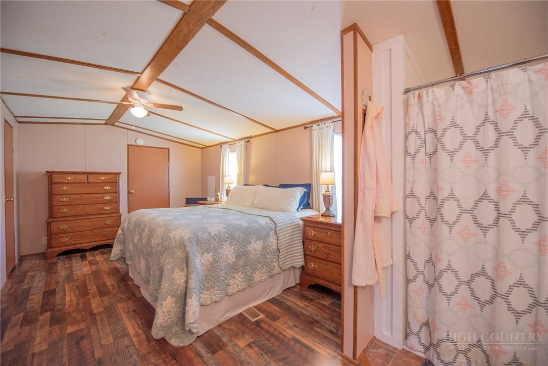 1848 West Mill Creek Road Warrensville, NC 28693 - Photo 26 of 50 a bedroom with a bed and a dresser