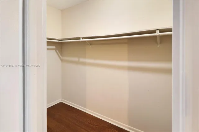 a view of hallway with wooden floor