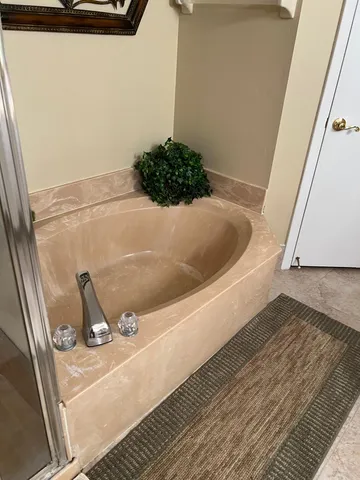 a bath tub sitting in a bathroom