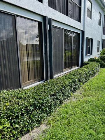 a view of a backyard with pathway