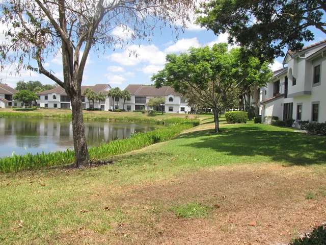 a view of a lake with a house in the background