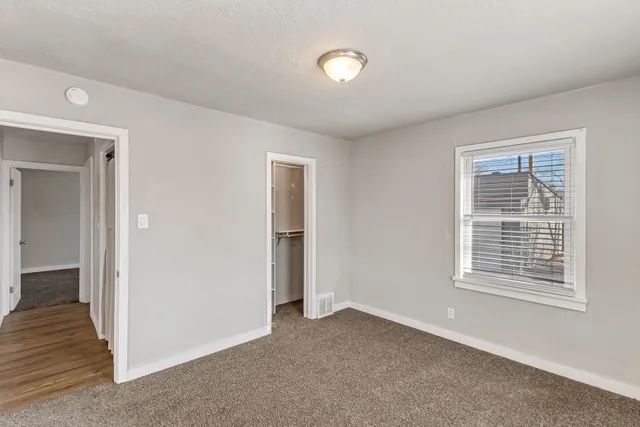a view of a hallway with washer and dryer