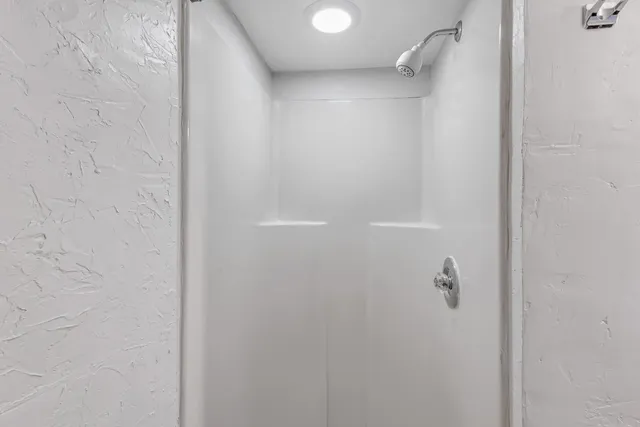 a view of a yard with a house and a tree