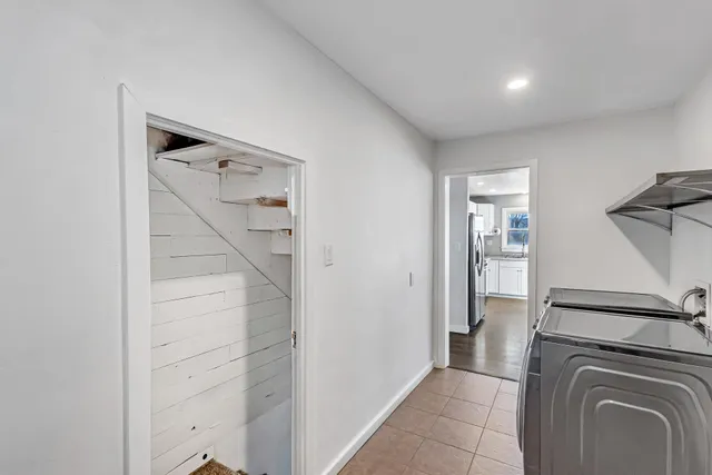 a view of house with snow on the road