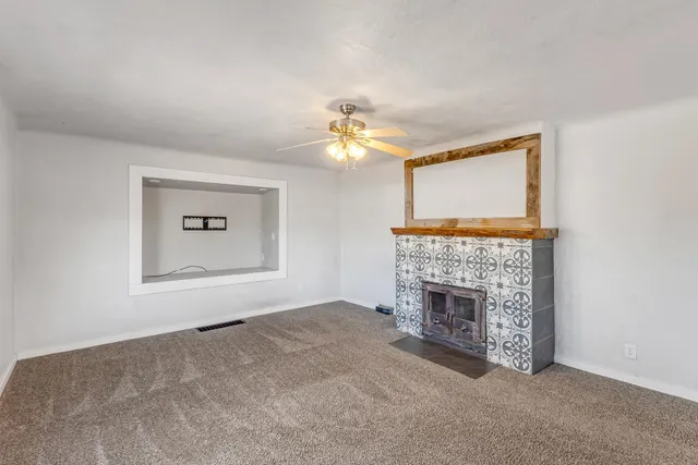 a kitchen with a refrigerator a sink dishwasher a stove and a microwave oven with wooden floor