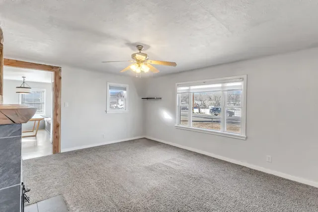 a view of a room with furniture window and wooden floor