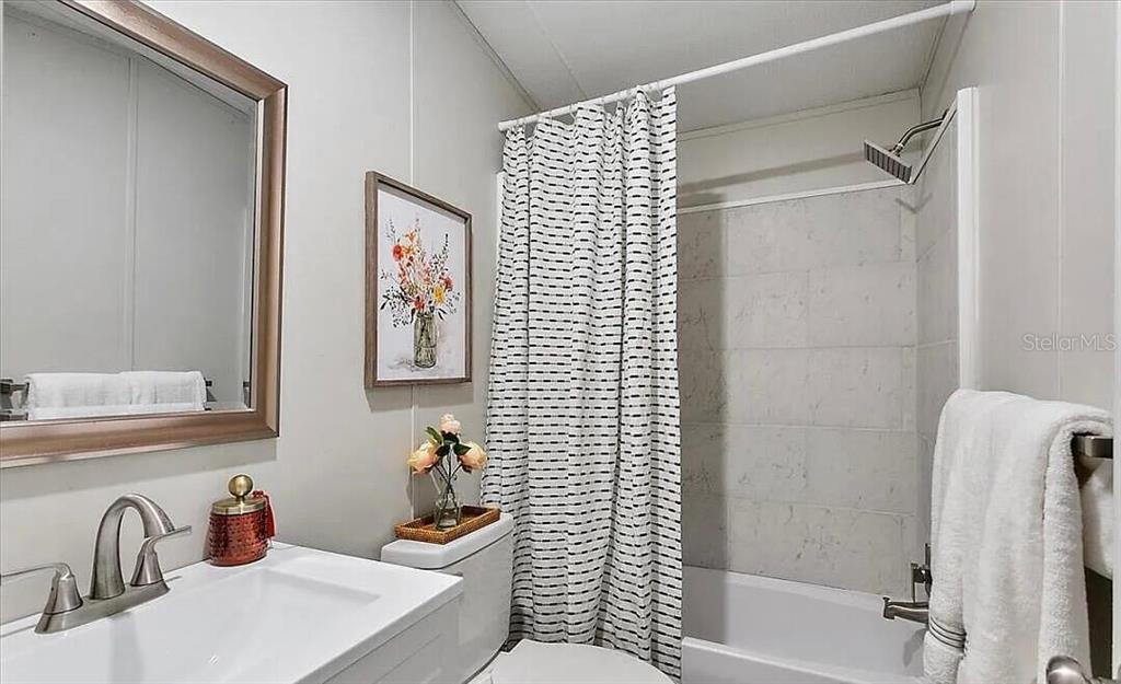 13712 Coman Road Jacksonville, FL 32218 - Photo 12 of 16 a bathroom with a sink toilet and shower