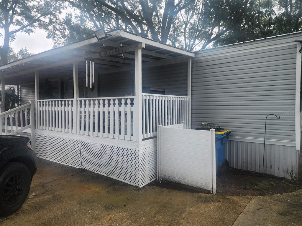 13712 Coman Road Jacksonville, FL 32218 - Photo 2 of 16 a view of a house with a yard and deck