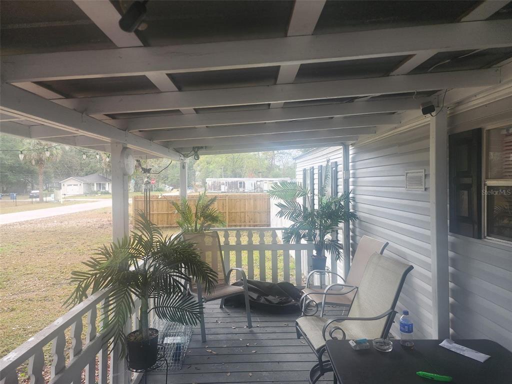 13712 Coman Road Jacksonville, FL 32218 - Photo 5 of 16 a porch with a glass door