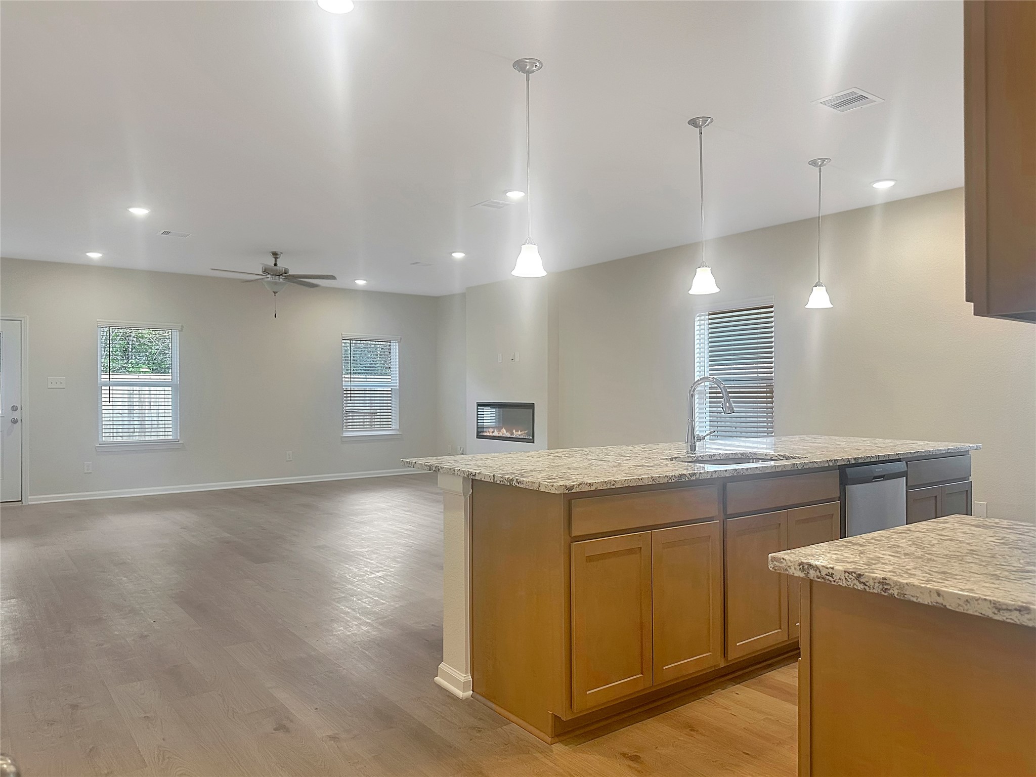 32515 Vly Redstem Way Fulshear, TX 77441 - Photo 5 of 19 The Crawford- Kitchen and Family Room. Home is under construction, photos used for illustration only; actual features, colors, and upgrades may vary.