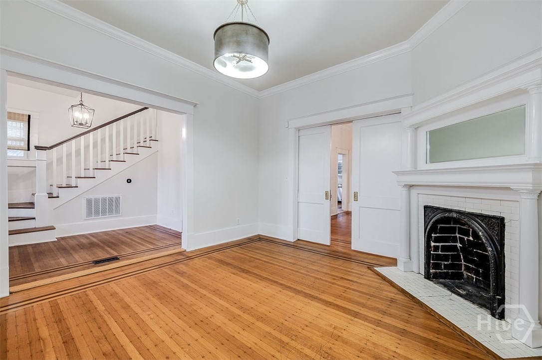 514 Maupas Avenue Savannah, GA 31401 - Photo 11 of 53 The opening to the living and dining rooms has working pocket doors.