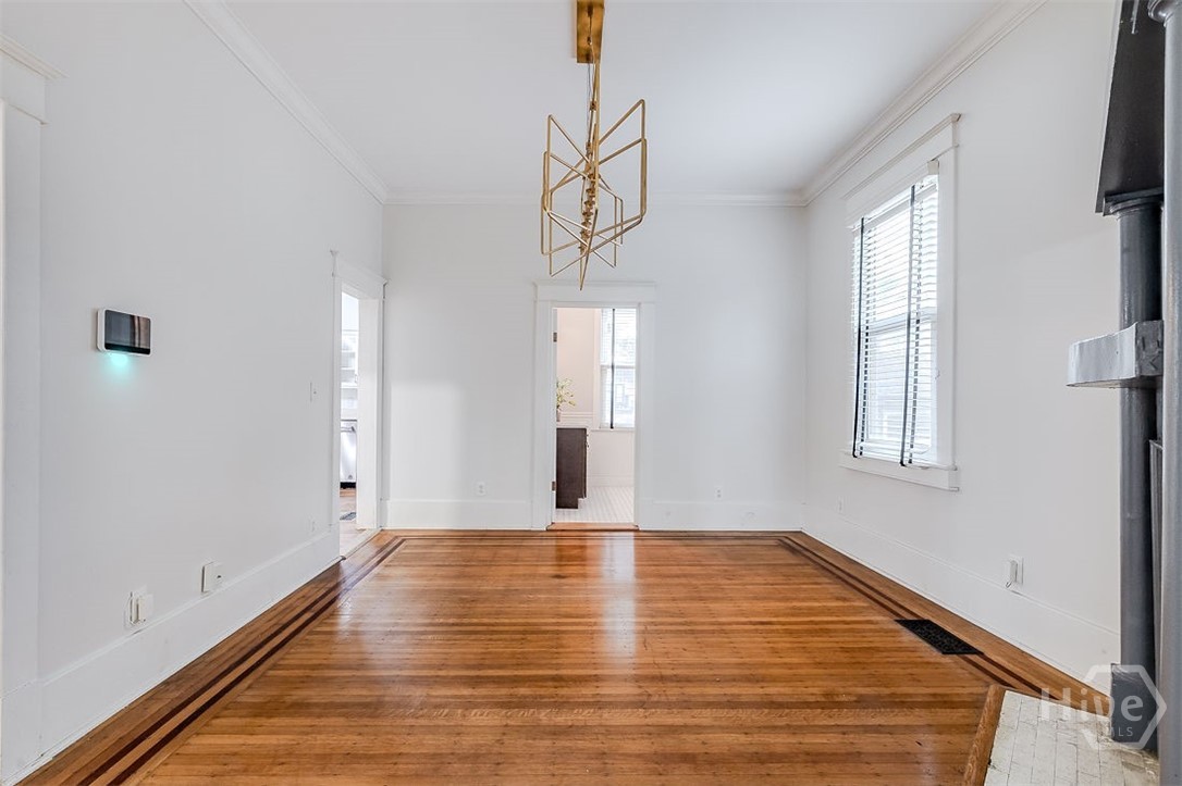 514 Maupas Avenue Savannah, GA 31401 - Photo 13 of 53 The dining room looking toward the main floor full bath with shower.