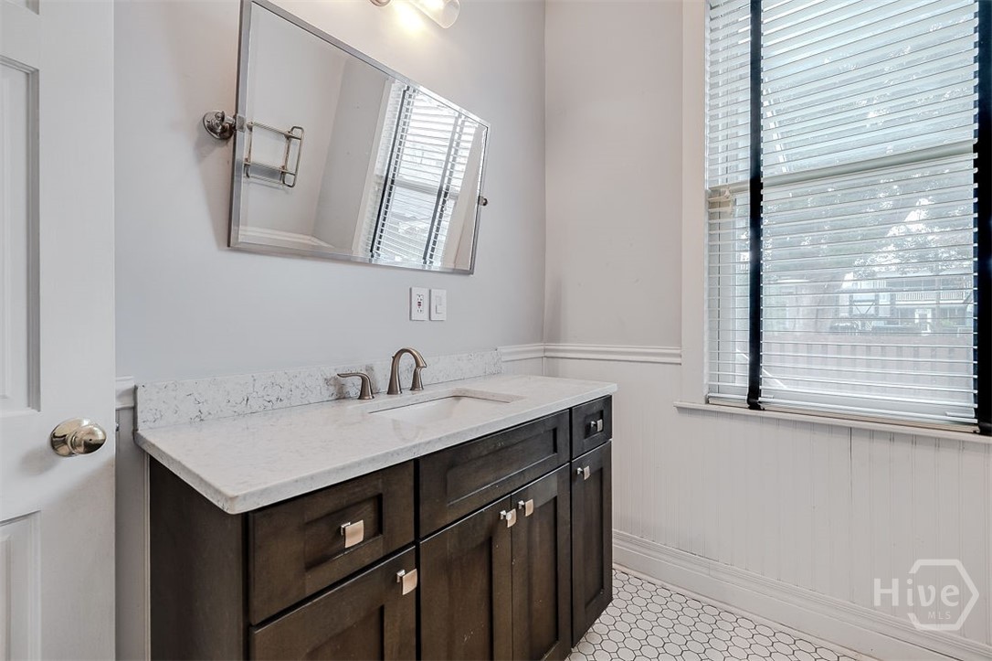 514 Maupas Avenue Savannah, GA 31401 - Photo 15 of 53 The vanity in the main floor bathroom. There is a breakfast/flex room on the main floor that could be used as a guest bedroom, so having a full bath on the main is a nice feature.