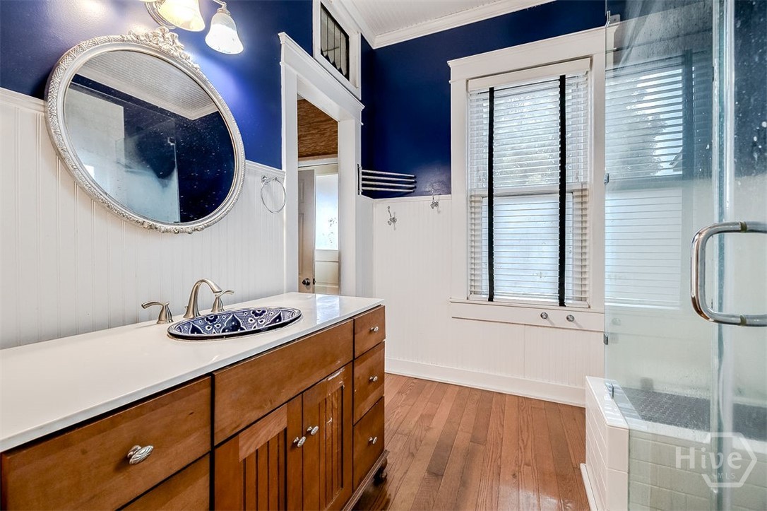 514 Maupas Avenue Savannah, GA 31401 - Photo 29 of 53 This is the Primary bath showing the very long vanity and walk-in shower.