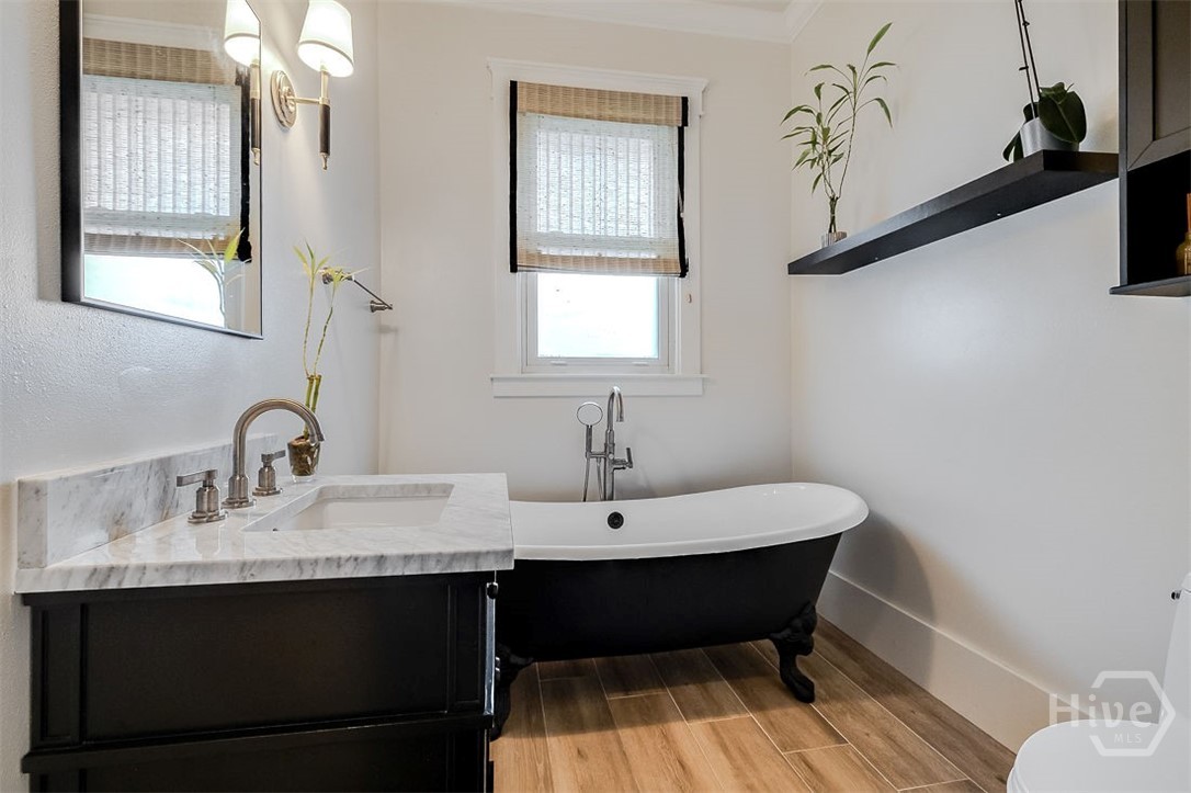 514 Maupas Avenue Savannah, GA 31401 - Photo 39 of 53 The second bathroom has a six foot long clawfoot tub, perfect for soaking. Beautiful oak floors and marble topped vanity.