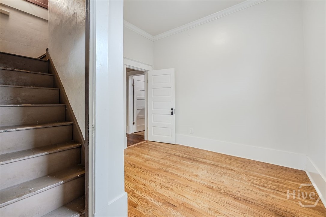 514 Maupas Avenue Savannah, GA 31401 - Photo 44 of 53 The third Bedroom showing stairs to attic work out space.