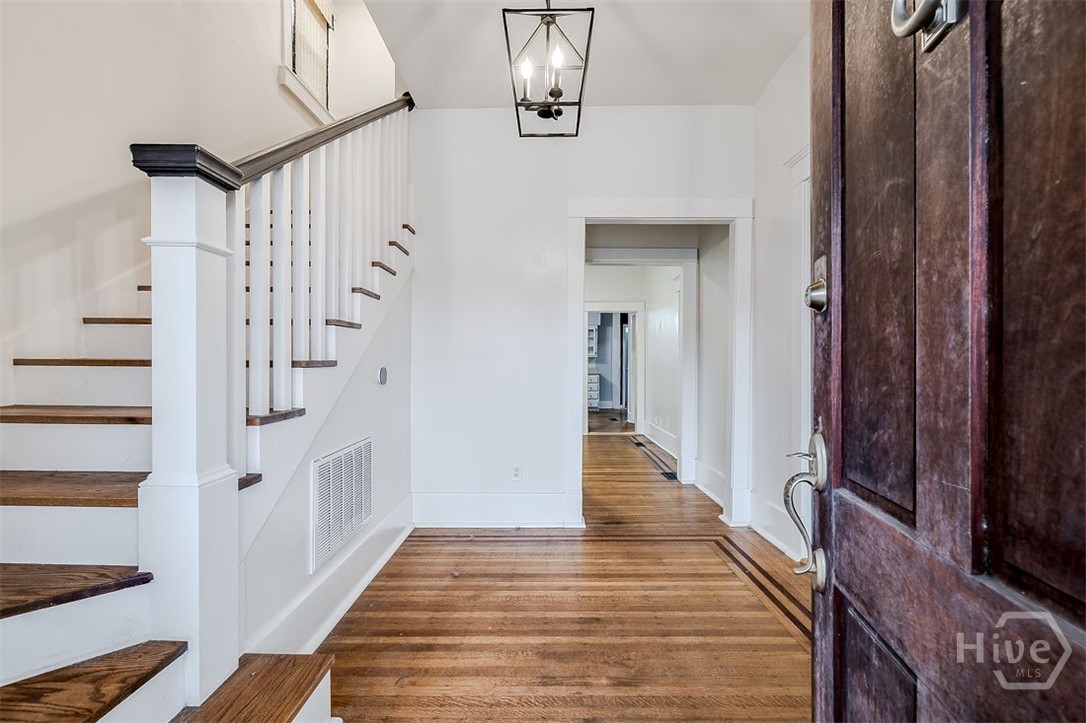 514 Maupas Avenue Savannah, GA 31401 - Photo 6 of 53 The etnryway is quite large and features top-nailed Oak flooring with Mahogany inlay.
