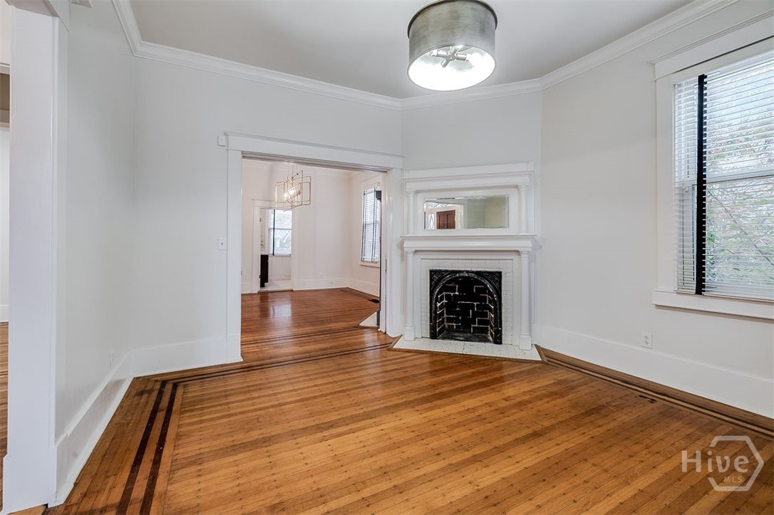 514 Maupas Avenue Savannah, GA 31401 - Photo 10 of 53 The large living room looking toward the equally large dining room.