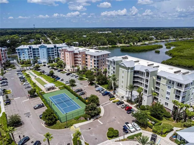 a view of a city with lots of residential buildings lake and ocean view
