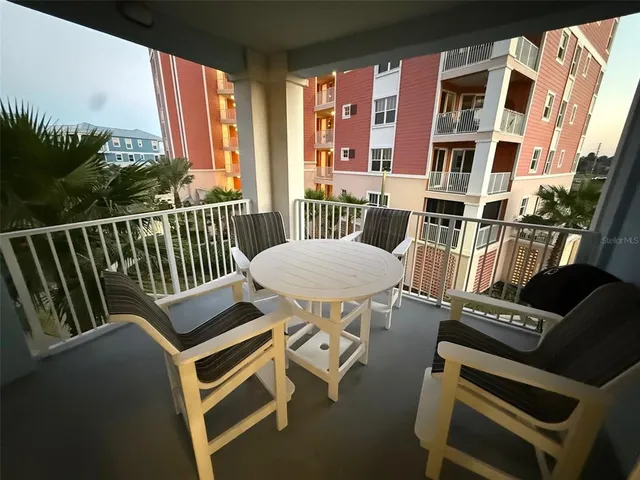 a view of a balcony with chairs