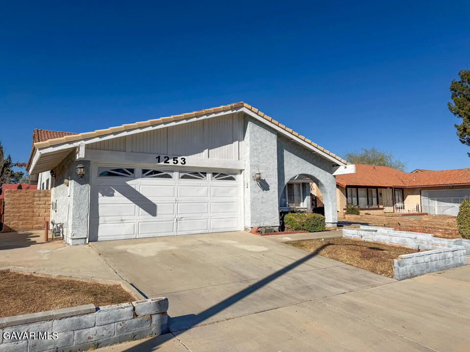 1253 Morven Street Lancaster, CA 93535 - Photo 1 of 18 a view of a house with a yard