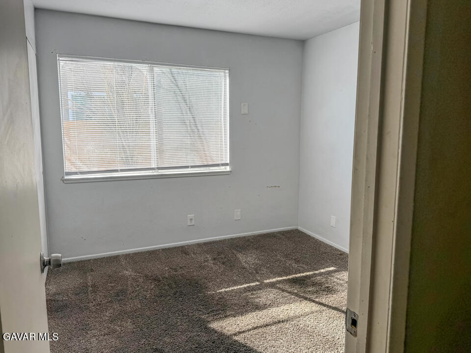 1253 Morven Street Lancaster, CA 93535 - Photo 12 of 18 an empty room with a window