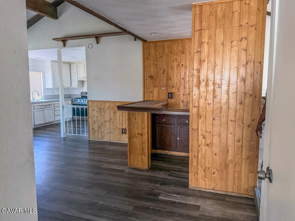 1253 Morven Street Lancaster, CA 93535 - Photo 14 of 18 a view of a kitchen with furniture and wooden floor
