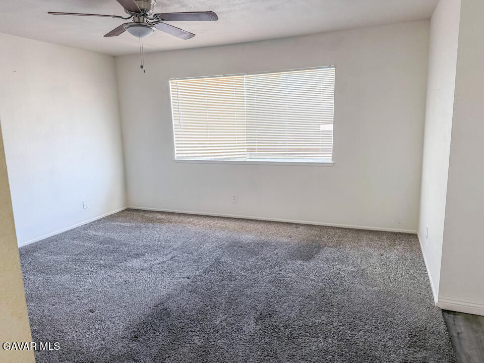 1253 Morven Street Lancaster, CA 93535 - Photo 8 of 18 an empty room with a window