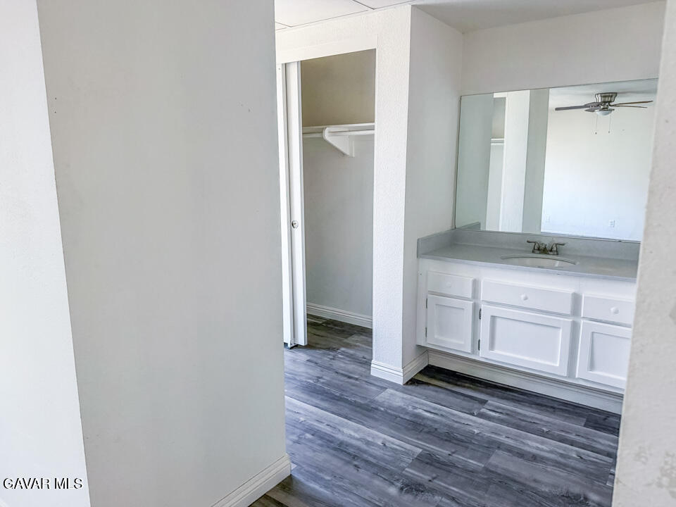 1253 Morven Street Lancaster, CA 93535 - Photo 9 of 18 a view of cabinets with wooden floor