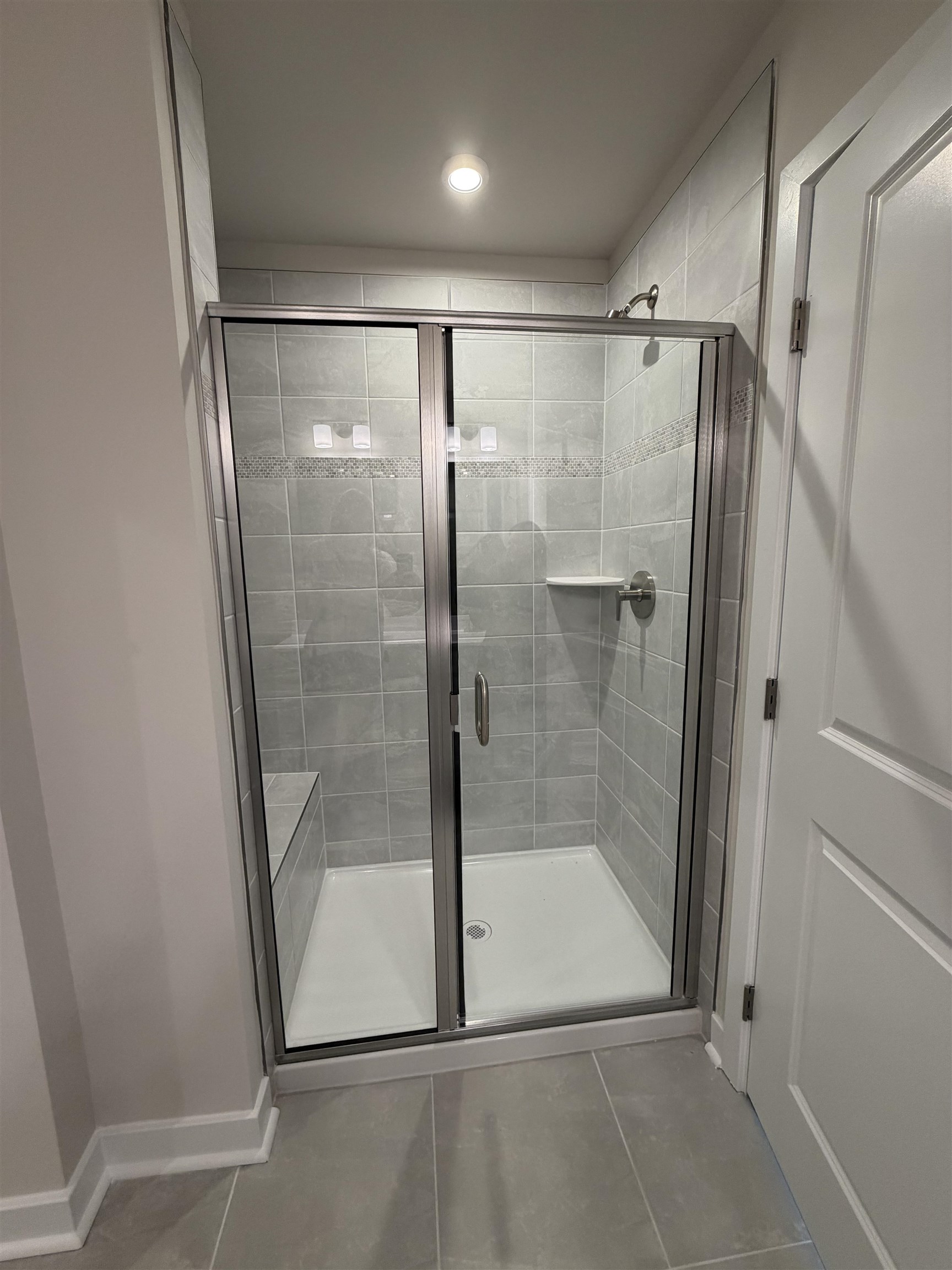 1311 Pleasant View Drive, Unit F North Myrtle Beach, SC 29582 - Photo 6 of 13 Bathroom featuring a stall shower and baseboards