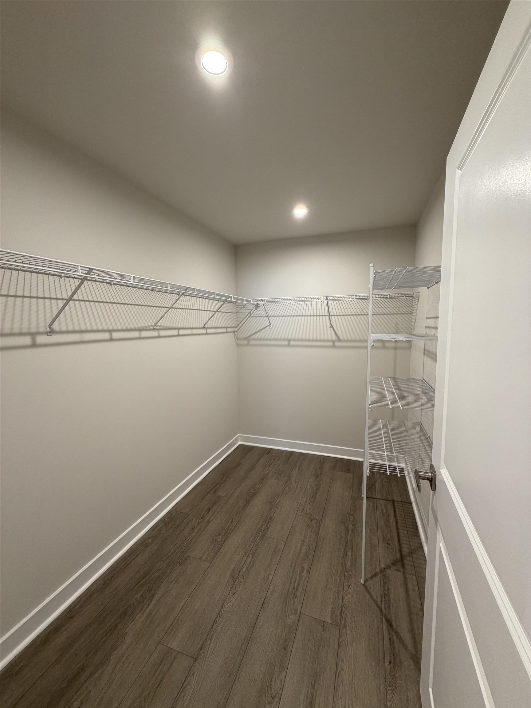 1311 Pleasant View Drive, Unit F North Myrtle Beach, SC 29582 - Photo 7 of 13 Spacious closet featuring dark wood finished floors