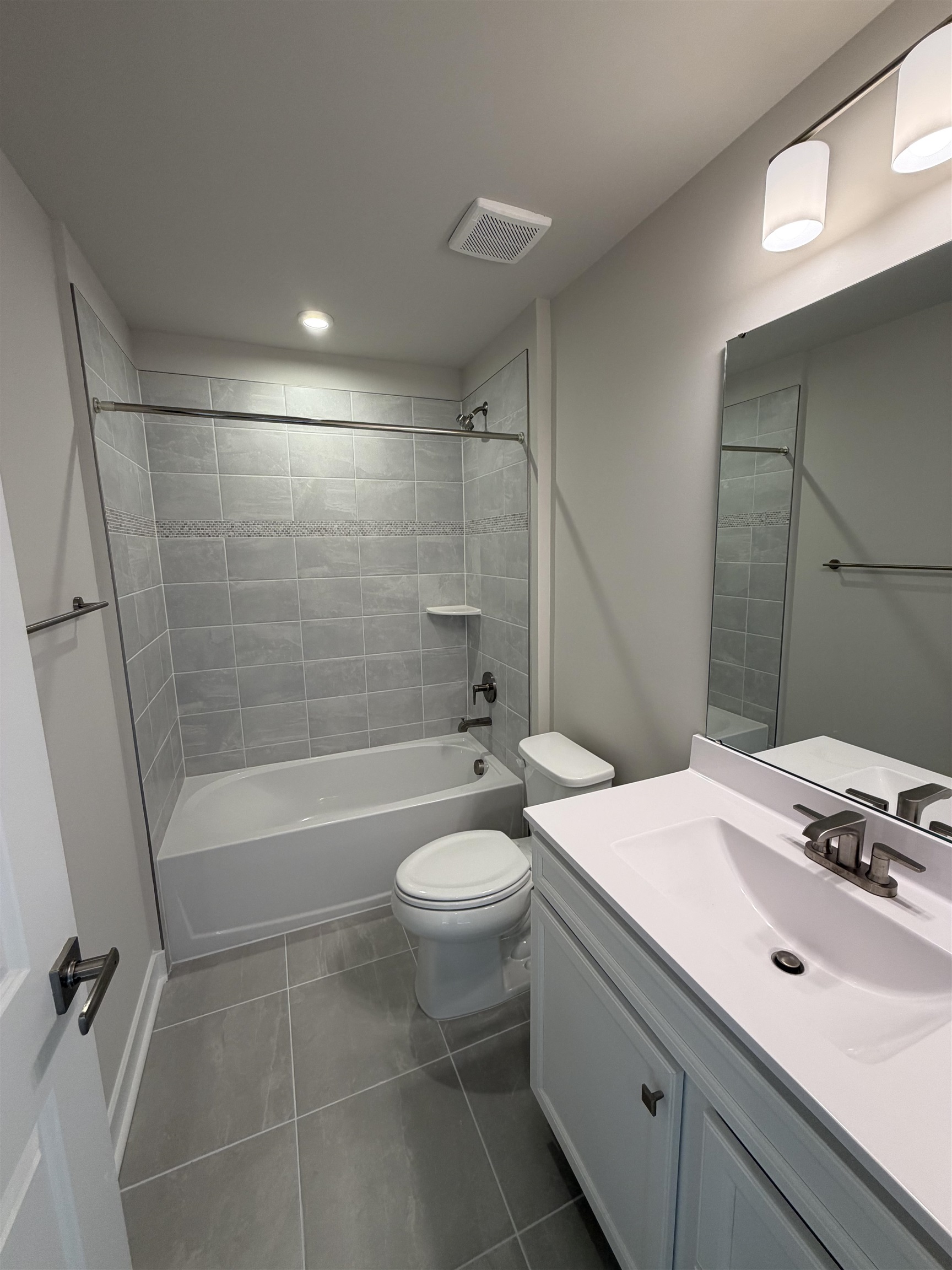 1311 Pleasant View Drive, Unit F North Myrtle Beach, SC 29582 - Photo 9 of 13 Full bathroom featuring vanity, bathing tub / shower combination, and dark tile patterned flooring