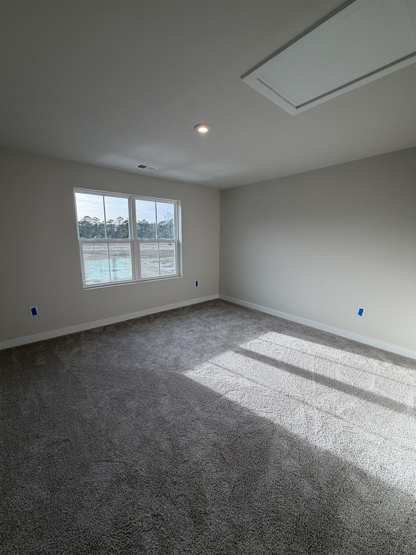 1311 Pleasant View Drive, Unit F North Myrtle Beach, SC 29582 - Photo 10 of 13 Empty room with carpet floors and recessed lighting